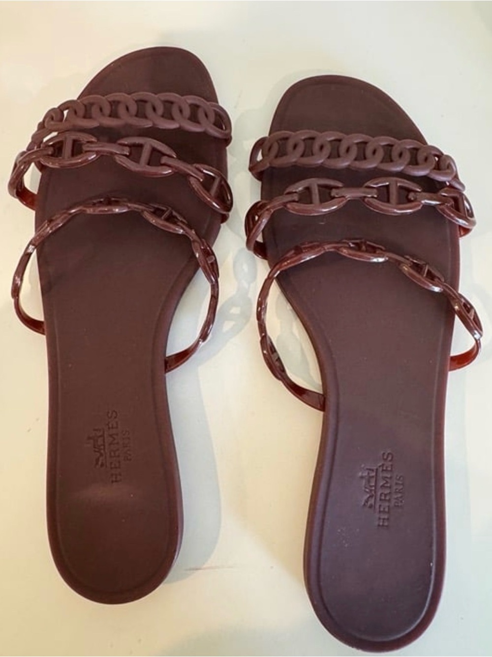 Women’s Brown Chain-Strap Slide Sandals - Cherry-colored rubber slippers.